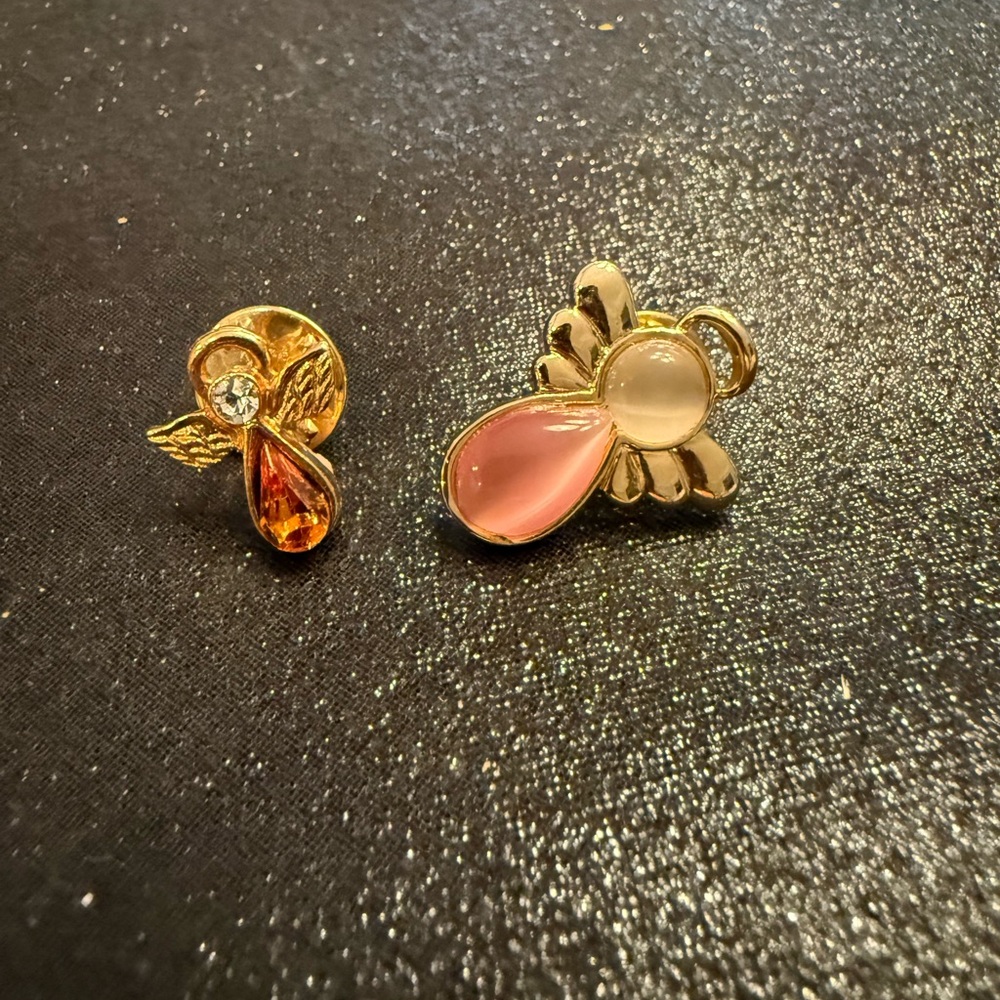 Two Angel Lapel spins. Cat’s eye & Citrine & Crystal. Gold Tone. Lg 1”, Sm 1/2”.